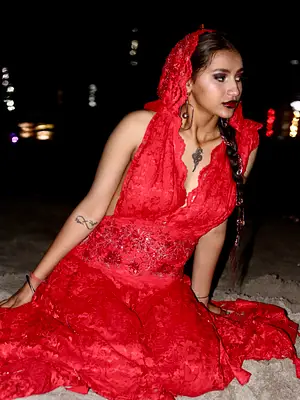 Model in green satin outfit