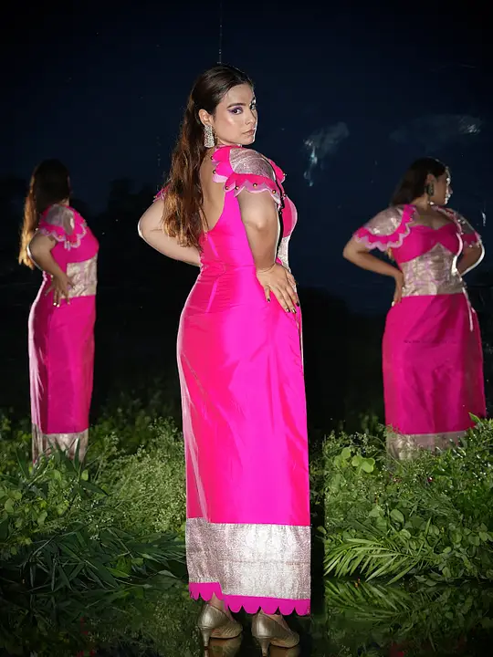 Model showing back details of green dress